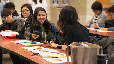 two international students talk during a workshop