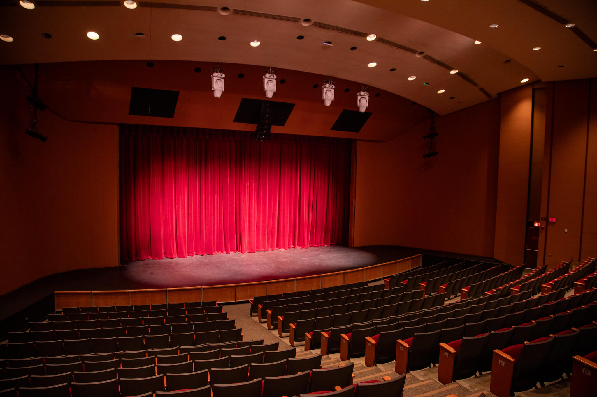 theater with a stage and red curtains