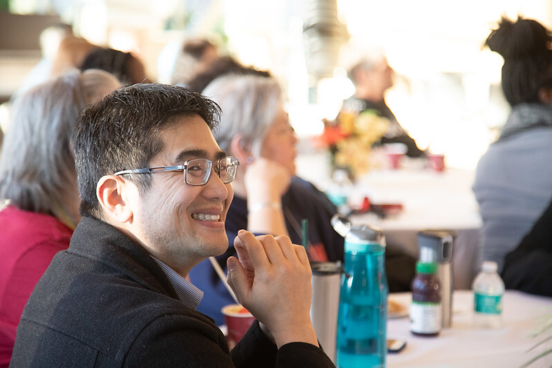 Perry Chen at table with colleagues