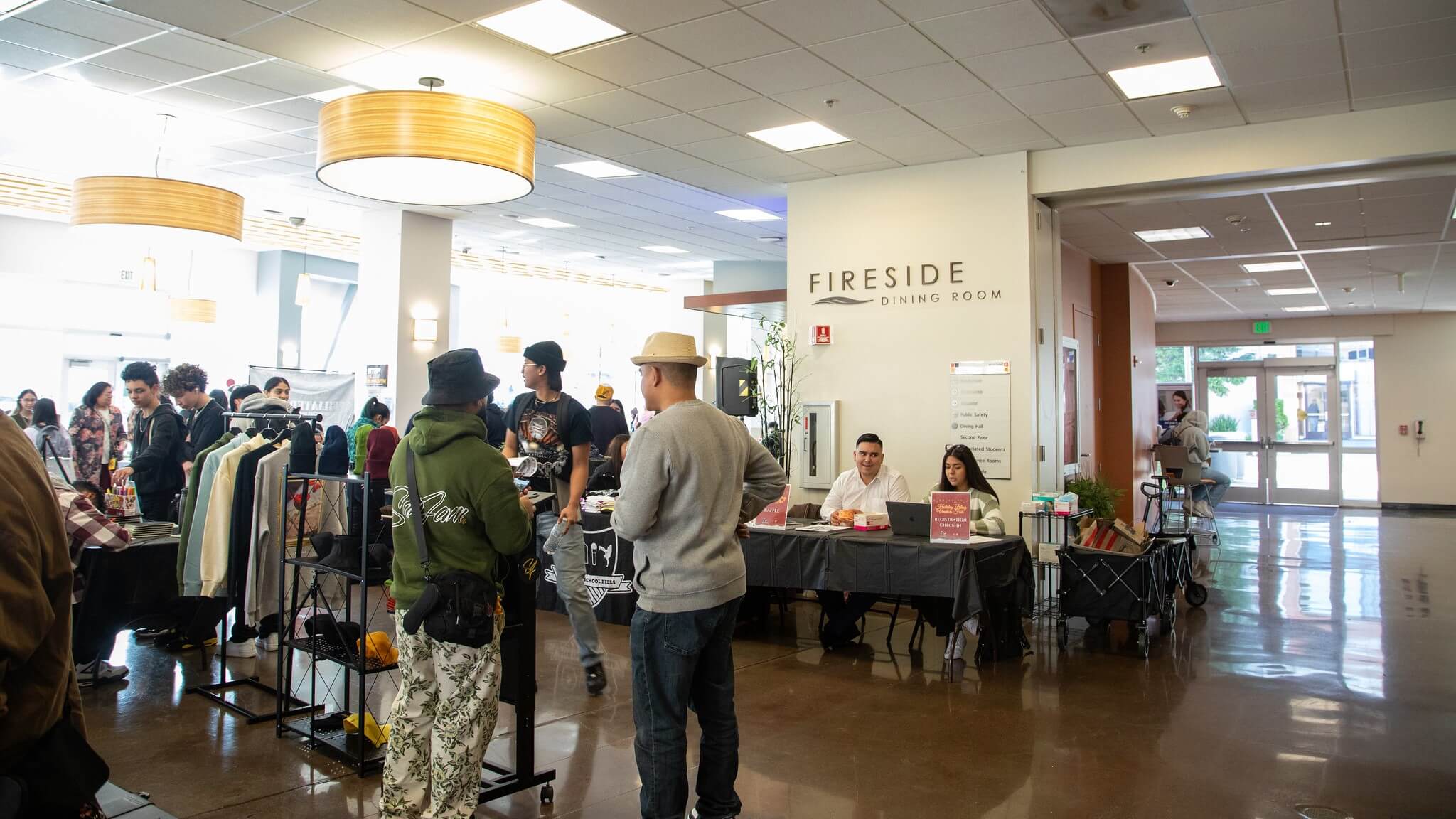 people standing in the fireside dining room, the college's main student union