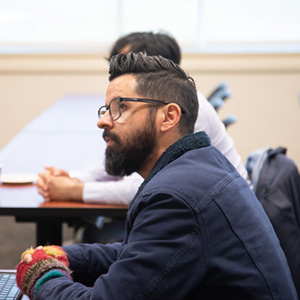 image of faculty member in a meeting to represent Curriculum Committee