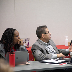 image of two faculty members in discussion to represent Educational Policy Committee